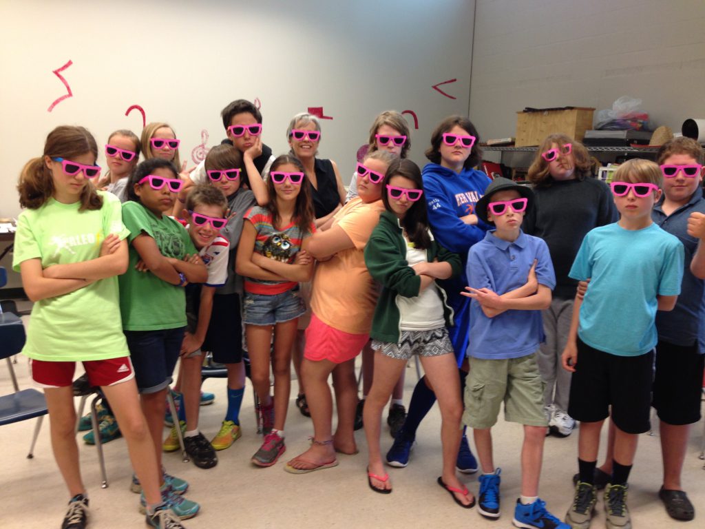 6th graders take a break from rehearsing What Is Pink?